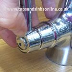 Removing Indicator from Tap Handle to access screw underneath.